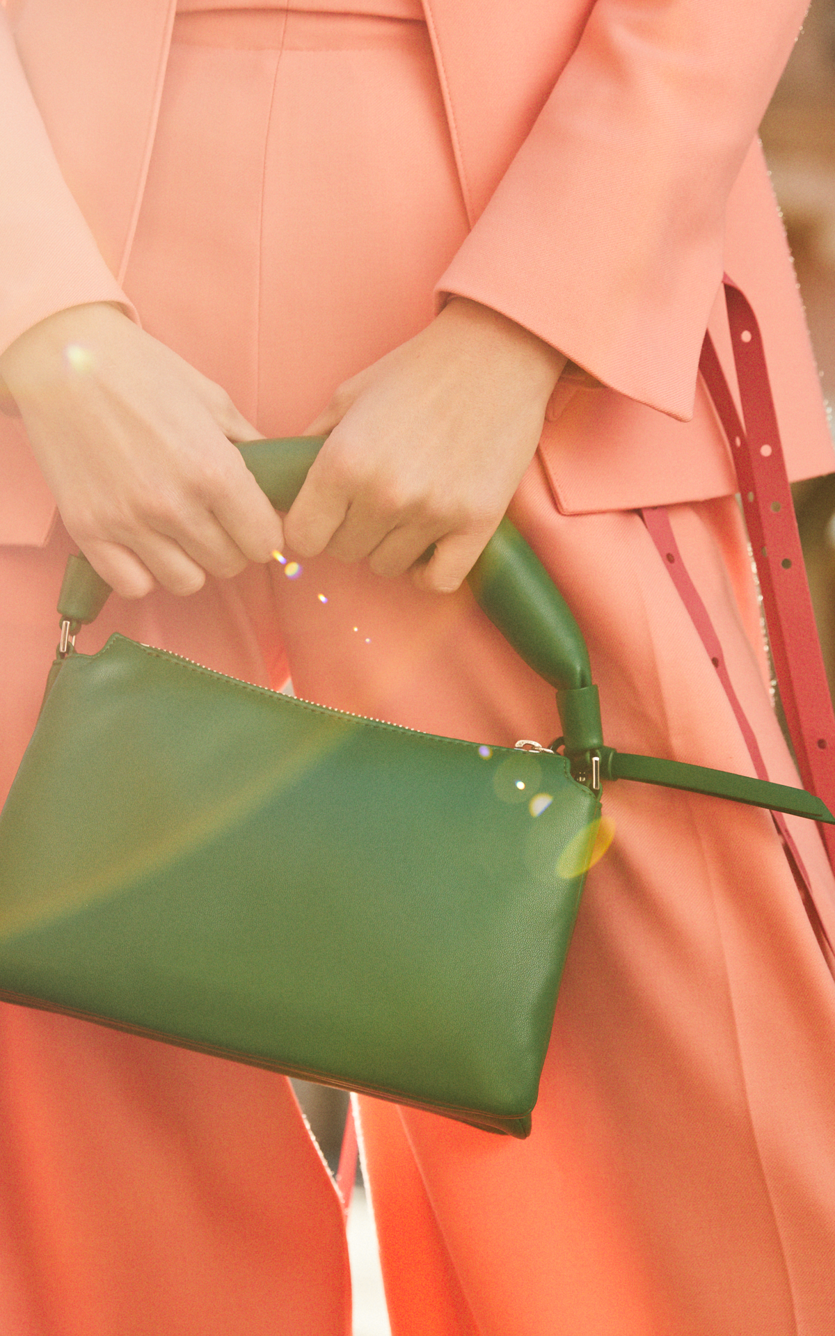 woman-holding-green-handbag