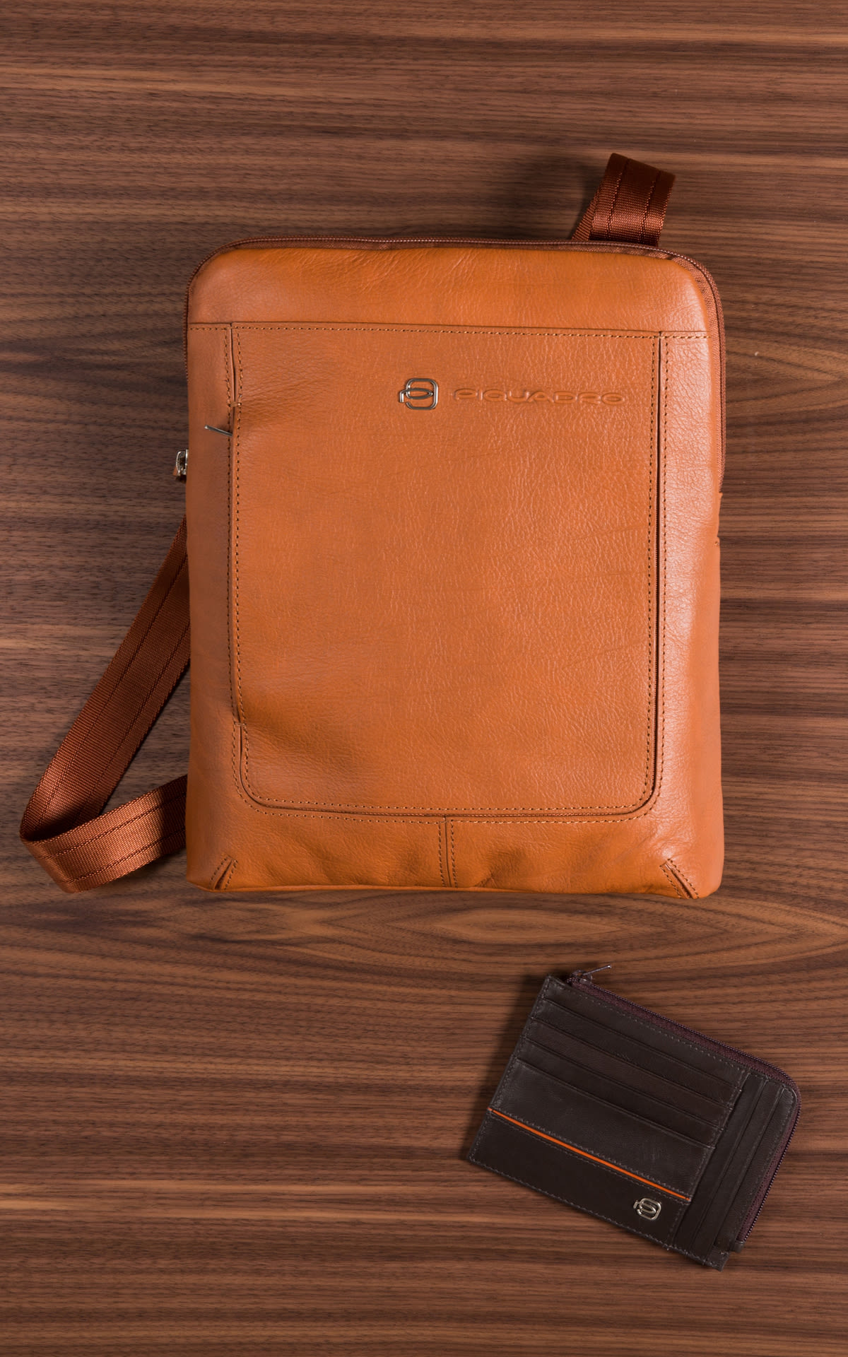 Men's camel leather bag and wallet from Piquadro