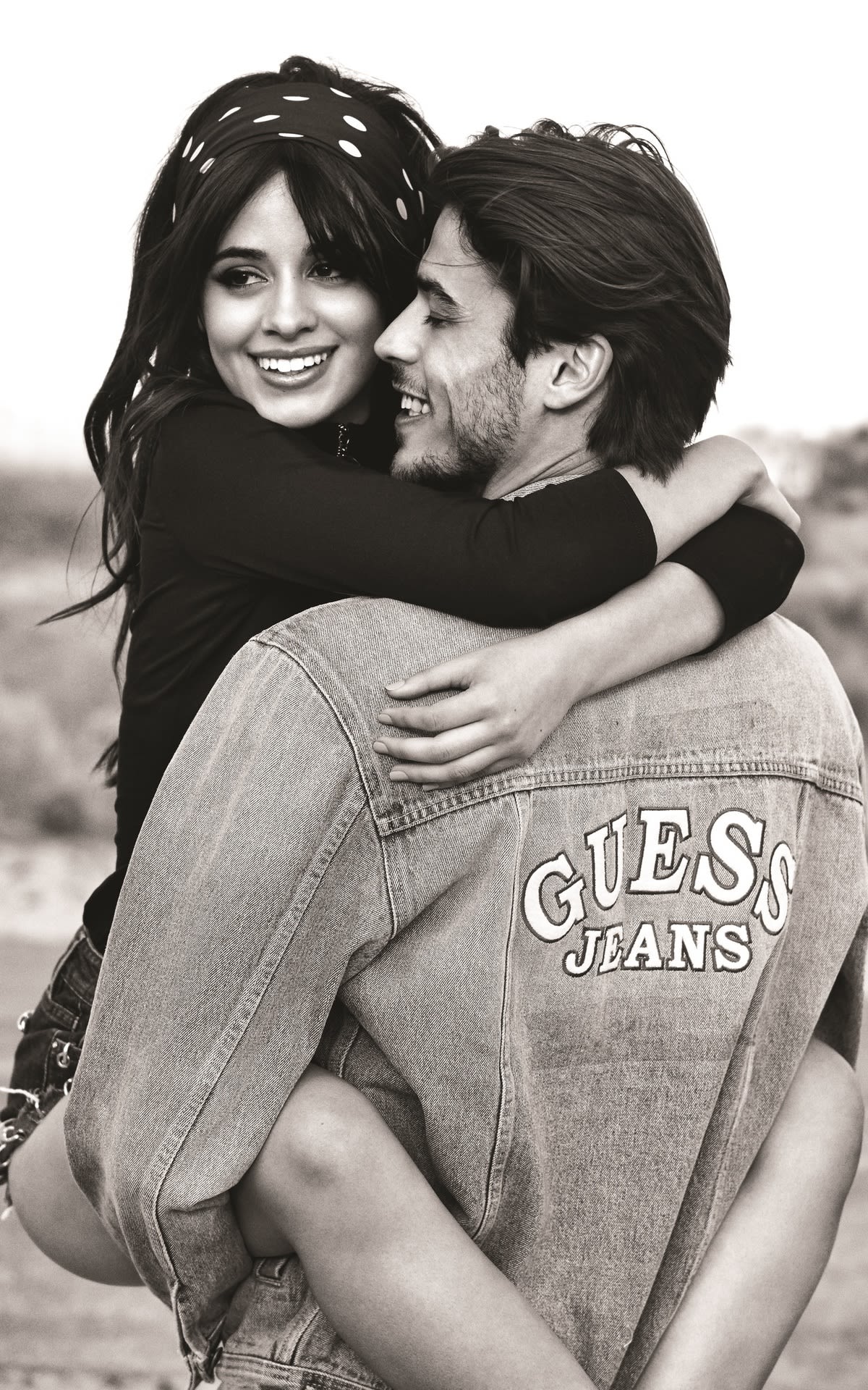 Couple hugging dressed with Guess clothes