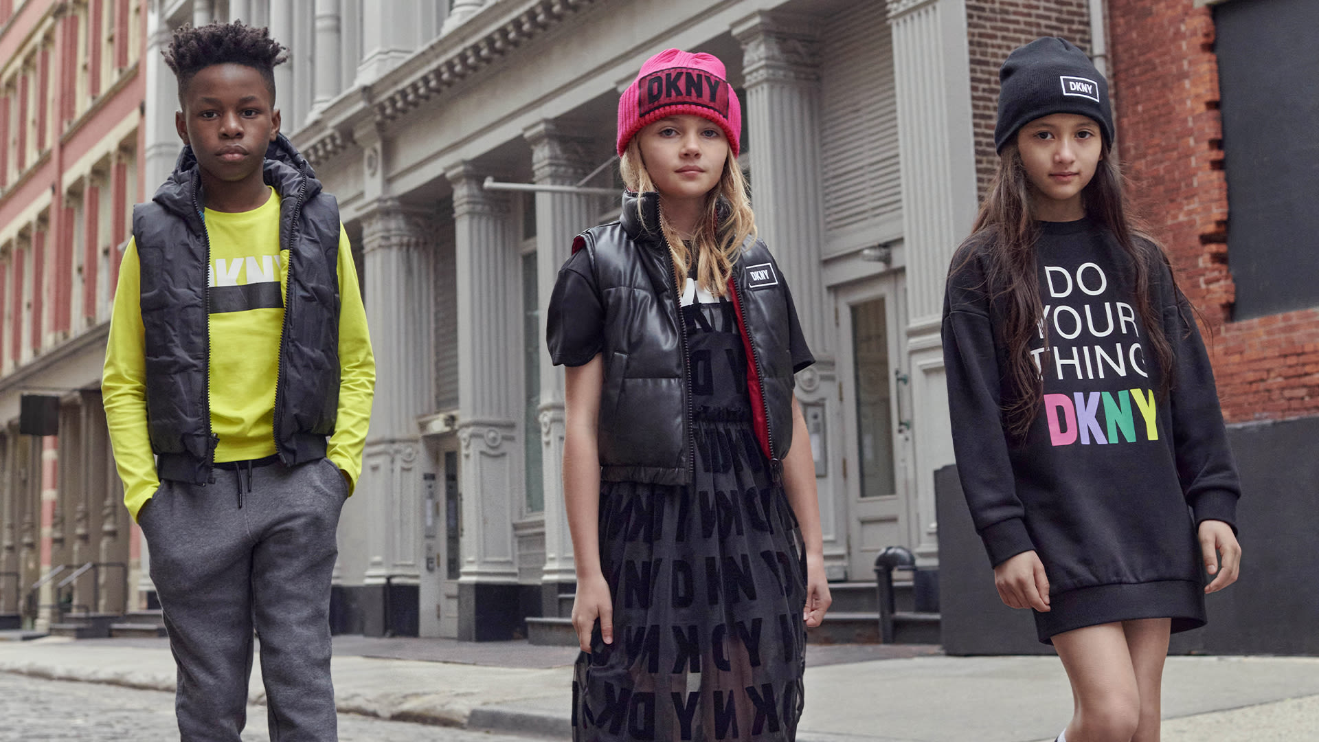 Kids dressed in black and red DKNY clothes