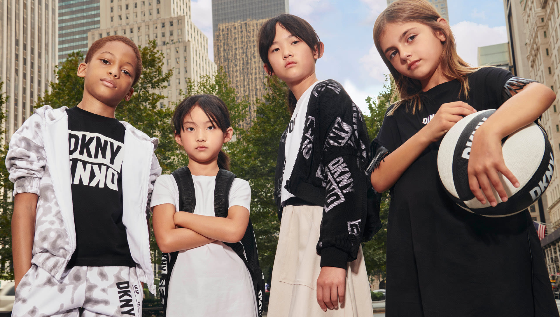 Kids dressed in black and red DKNY clothes