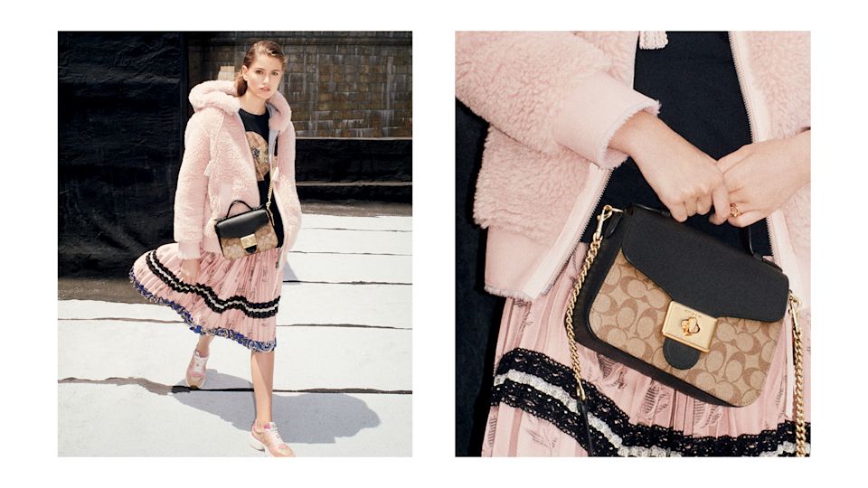 Model holding Coach bag