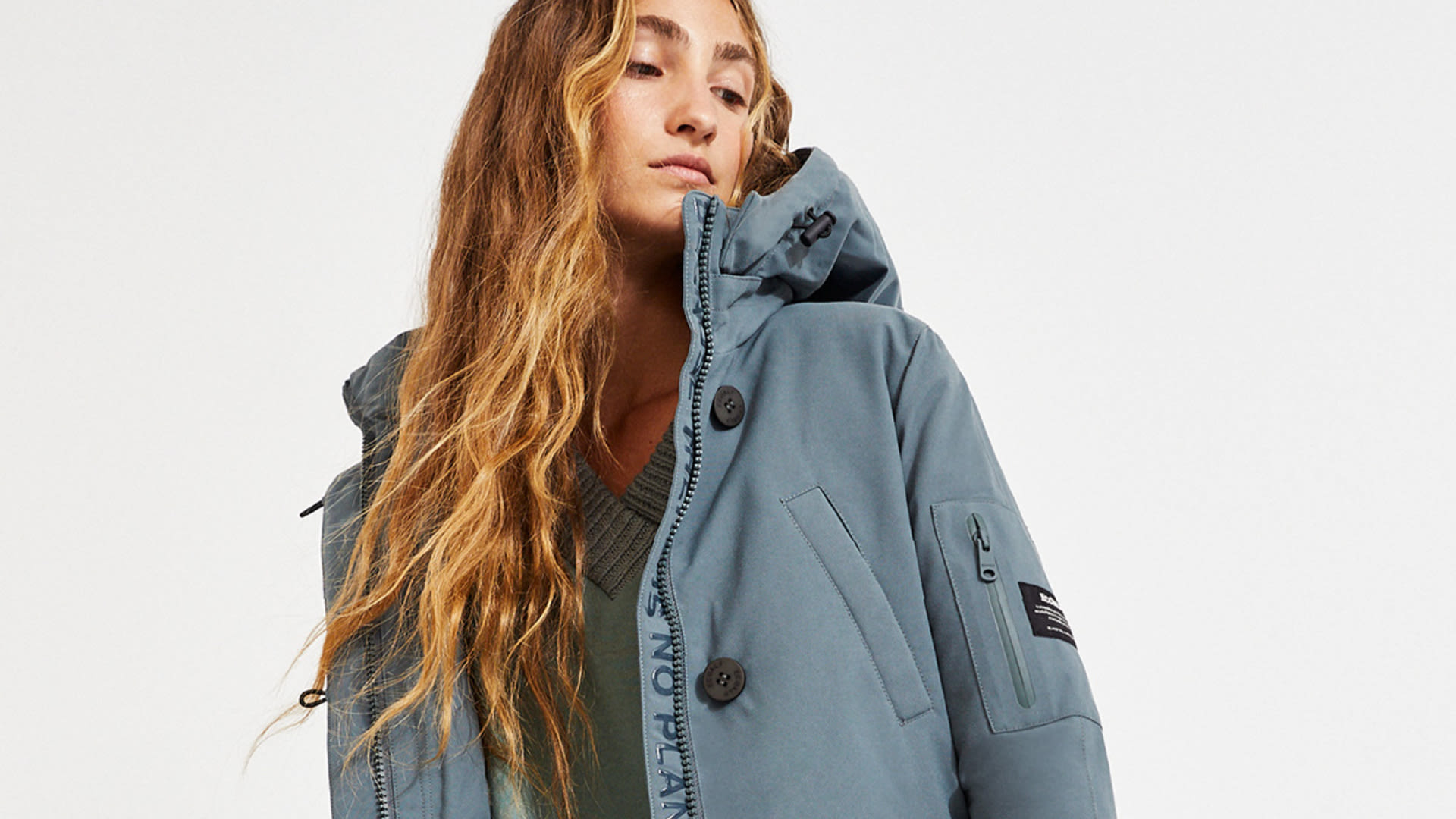 Girl with a blue jacket from Ecoalf