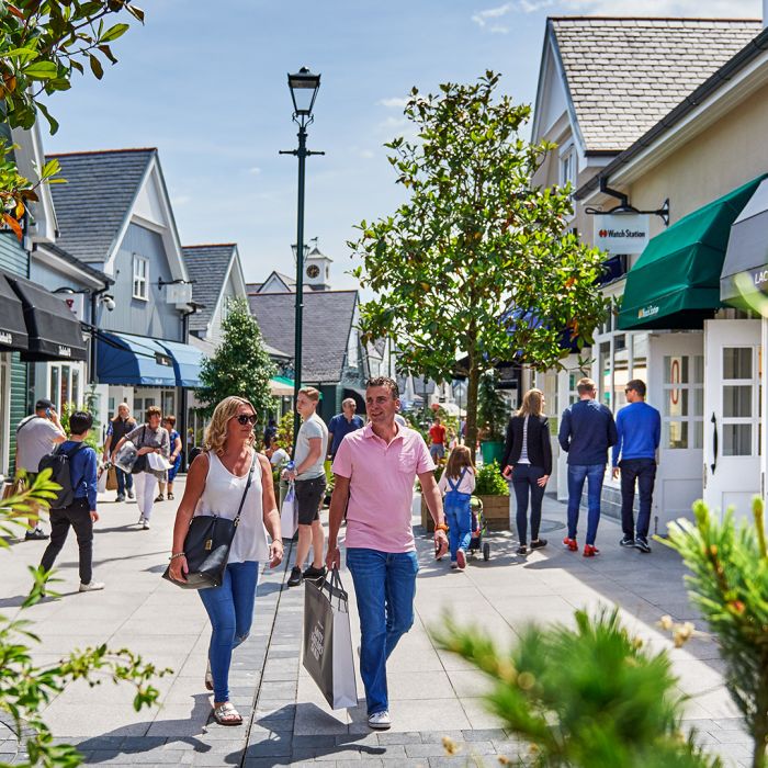 Kildare Village busy main mall on sunny day