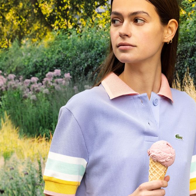 Girl in purple Lacoste top eating ice cream in Bicester Village
