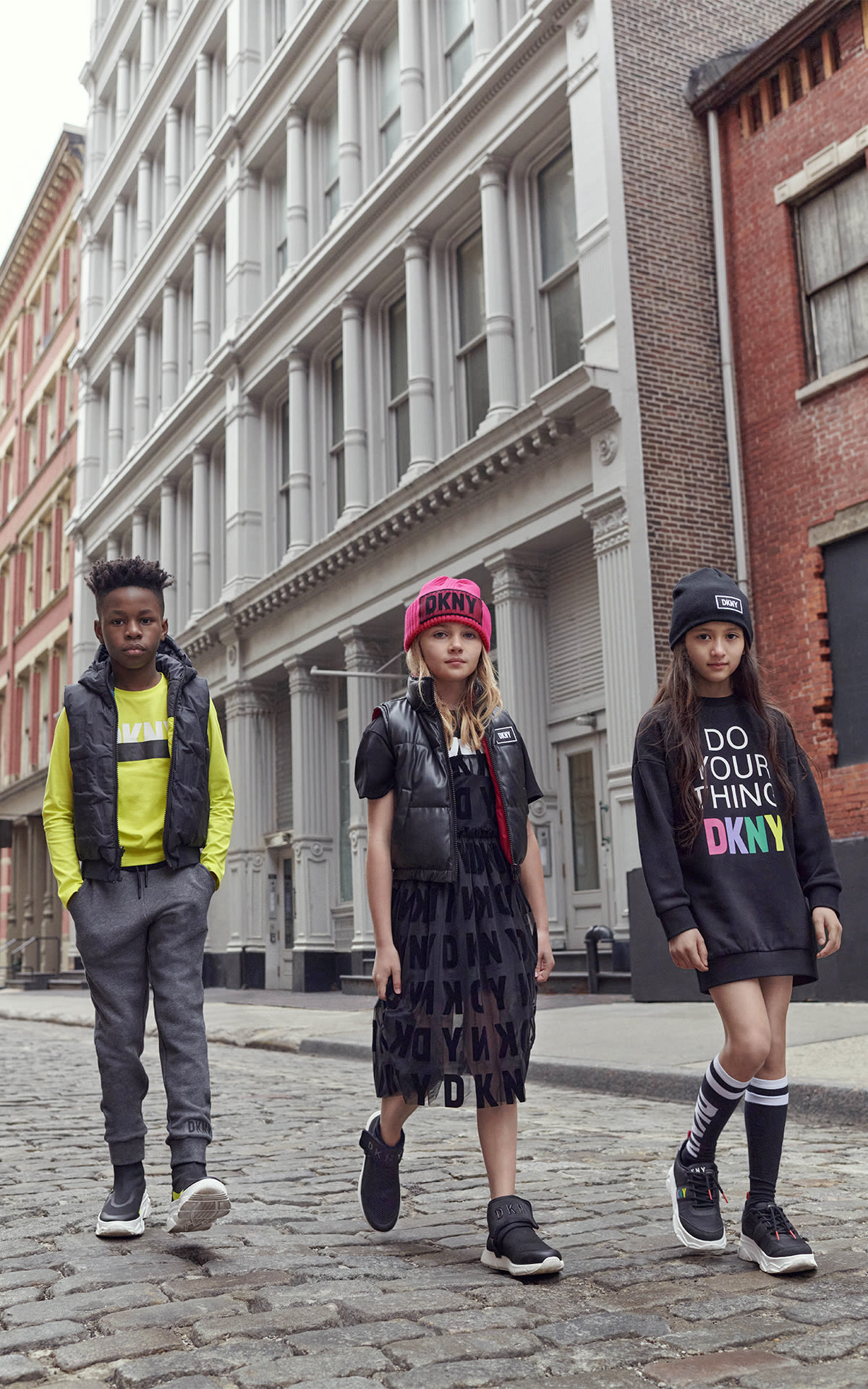 Kids dressed in black and red DKNY clothes